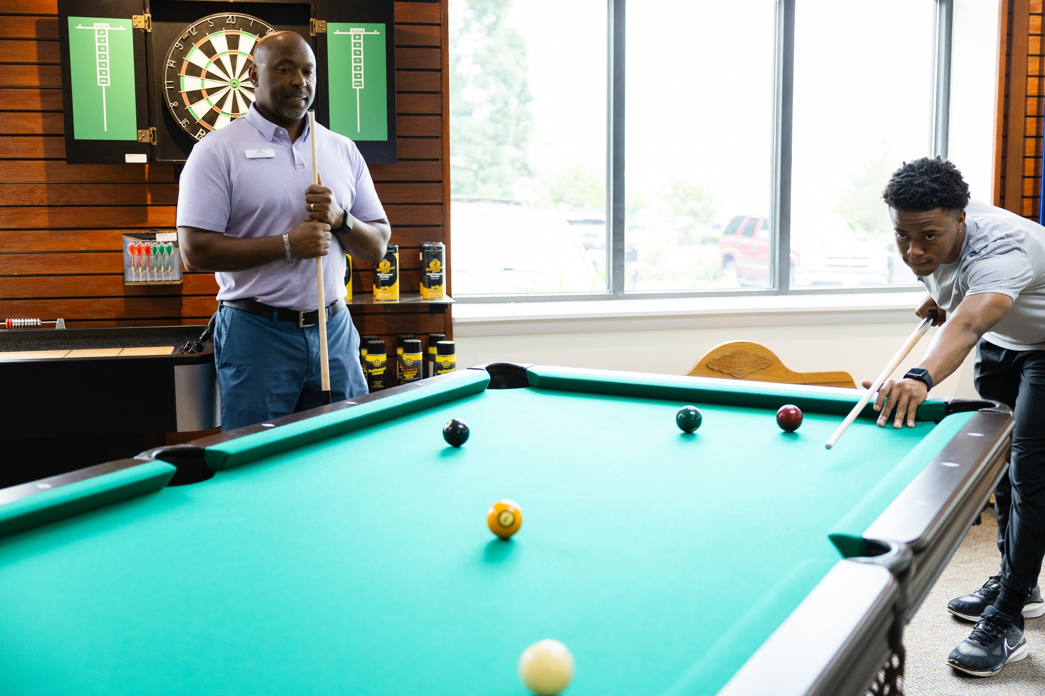 Brunswick billiards table in a handsome game room