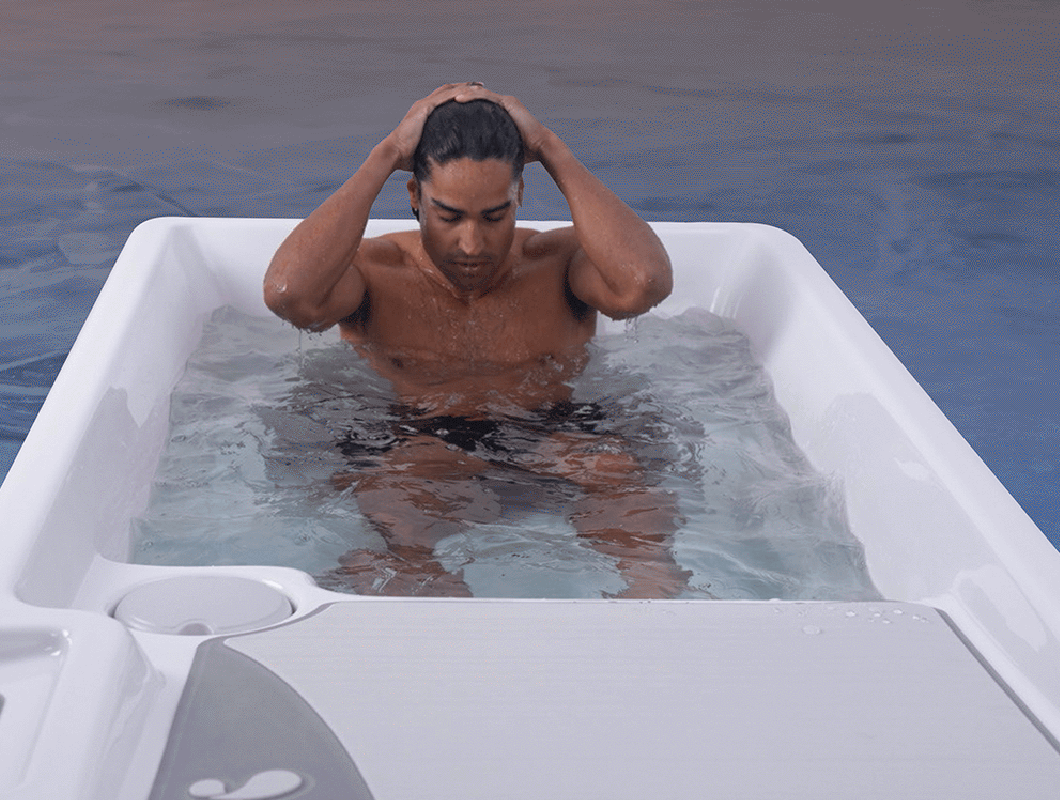 Man sitting in a cold plunge